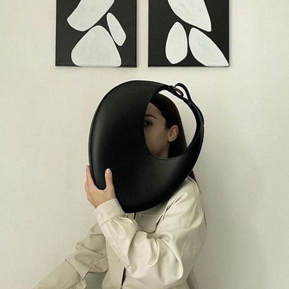 The Signature Curve Bag